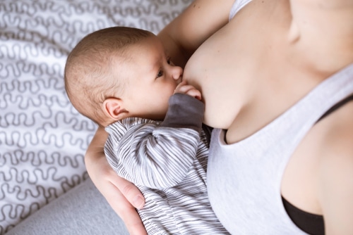 mother breastfeeding and hugging baby-img-blog